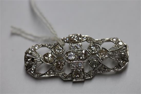 A 1930s/1940s pierced platinum? and diamond set brooch,